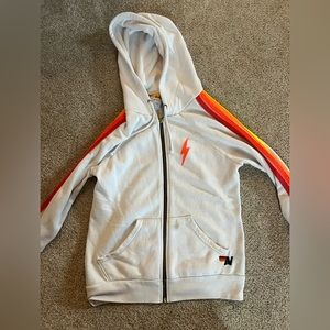 White Aviator Nation zip up with neon strips along the side